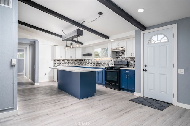 kitchen featuring a kitchen island, white cabinetry, black range with gas stovetop, hanging light fixtures, and blue cabinetry