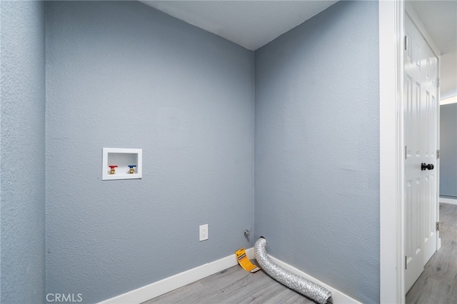 laundry area with washer hookup and light wood-type flooring