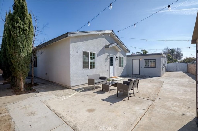 back of property featuring a patio