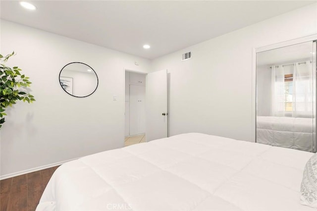 bedroom featuring dark hardwood / wood-style flooring