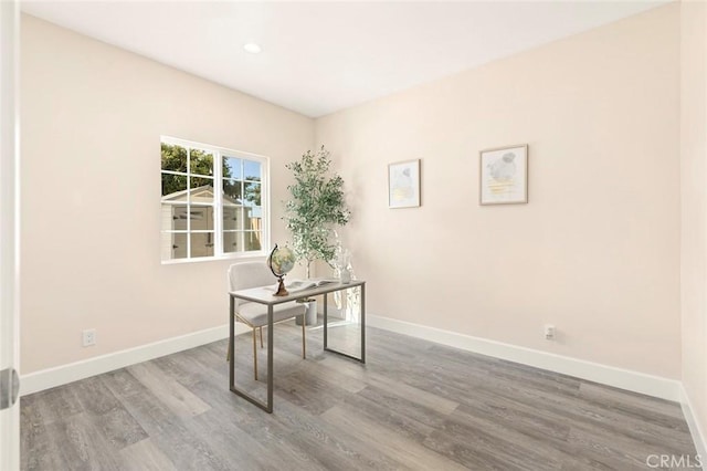 unfurnished office with wood-type flooring