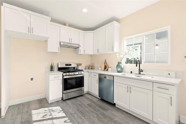 kitchen featuring sink, white cabinets, and appliances with stainless steel finishes