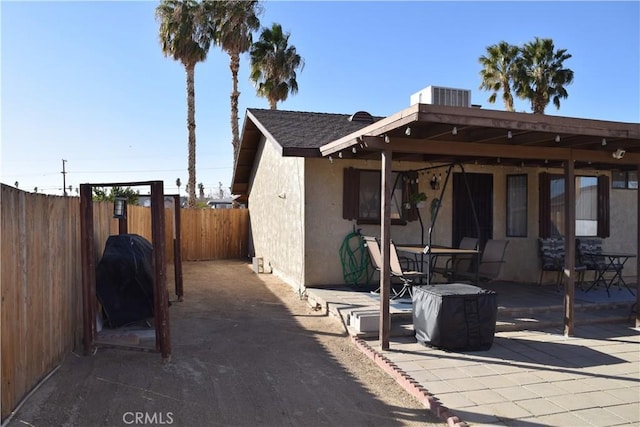 exterior space featuring central AC unit and a patio