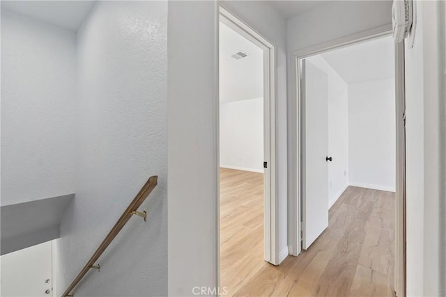 hall with light hardwood / wood-style floors