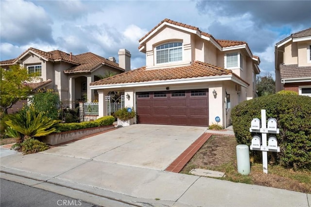 mediterranean / spanish house featuring a garage