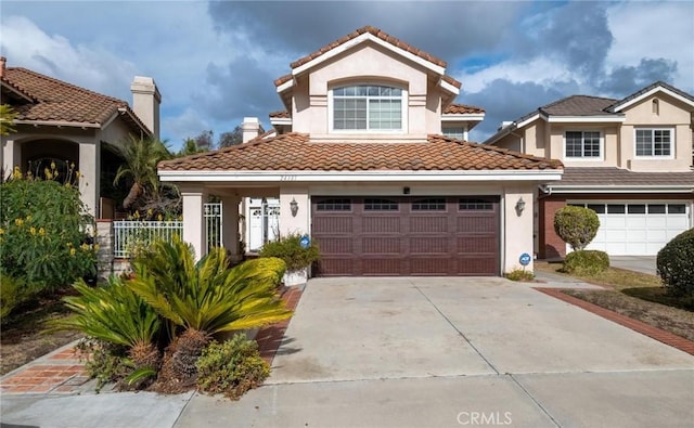 mediterranean / spanish-style home featuring a garage