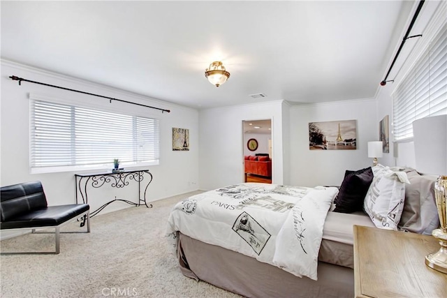 bedroom featuring ornamental molding and carpet flooring