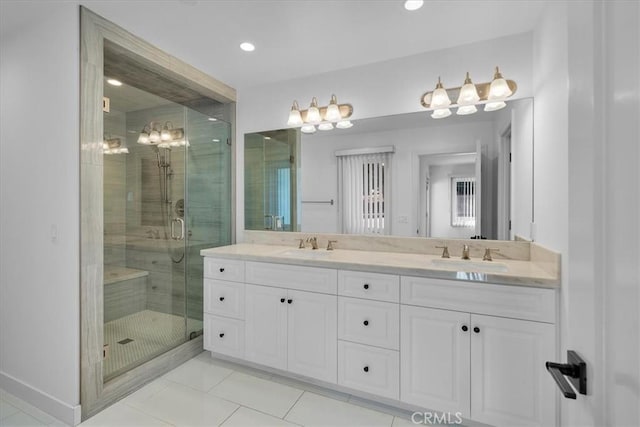 bathroom featuring vanity, tile patterned floors, and walk in shower