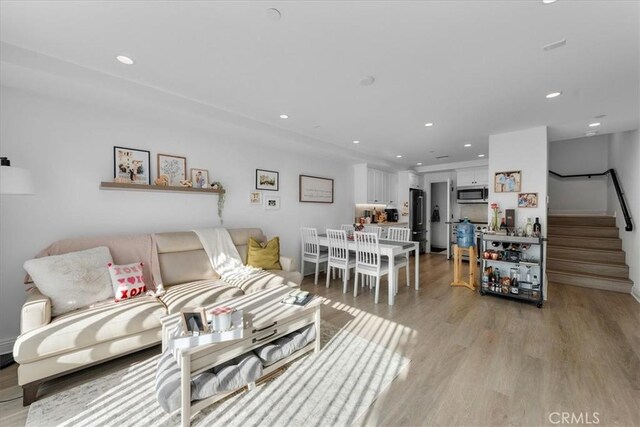 living room featuring light wood-type flooring