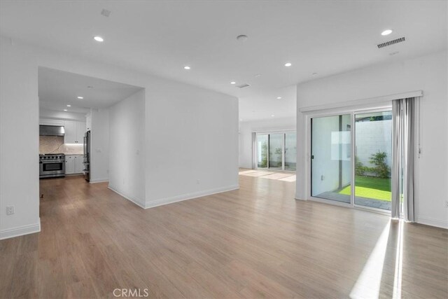 empty room with light wood-type flooring