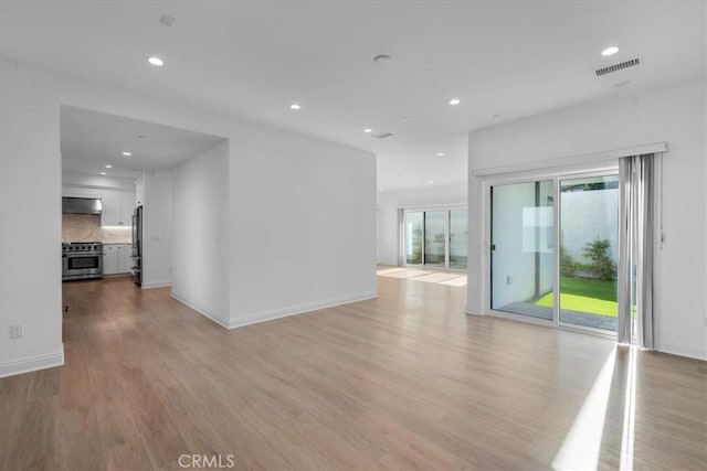 unfurnished room featuring light hardwood / wood-style flooring