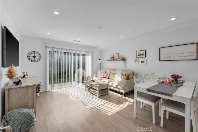 living room with light hardwood / wood-style flooring