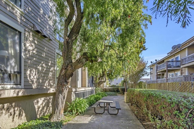 view of home's community with a patio area