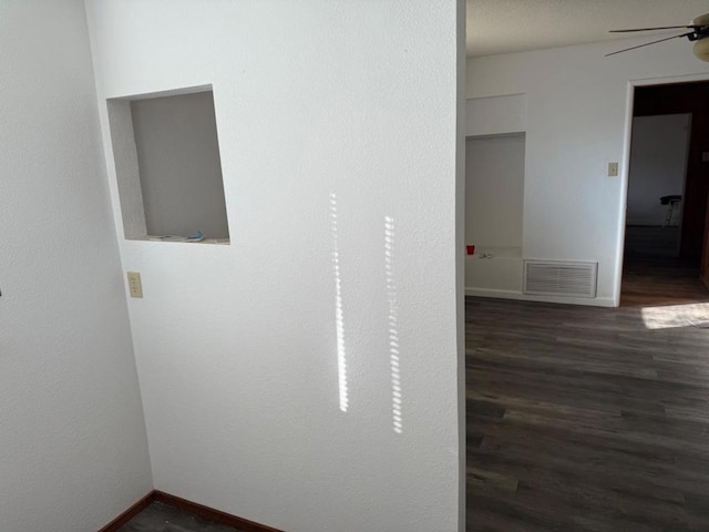 hallway featuring dark hardwood / wood-style flooring