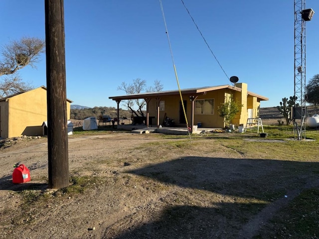 rear view of house with a shed