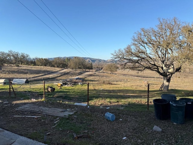 view of yard with a rural view