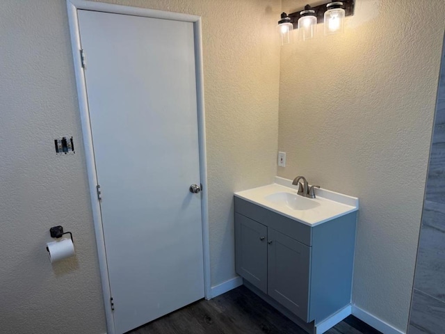 bathroom featuring vanity and wood-type flooring