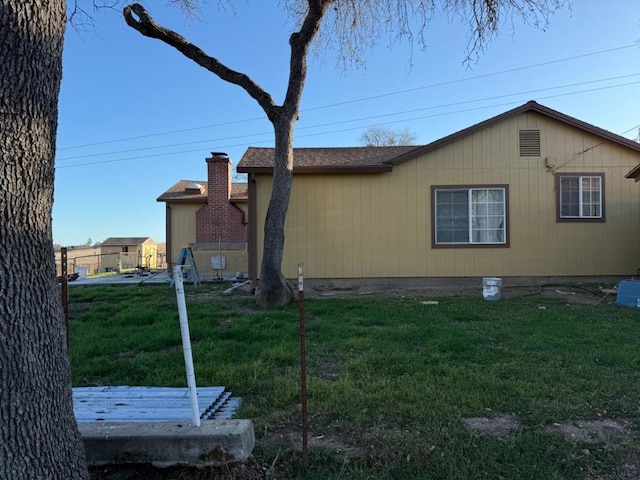 view of property exterior featuring a yard