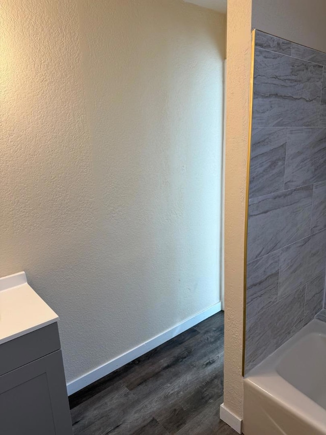 bathroom with vanity and hardwood / wood-style floors