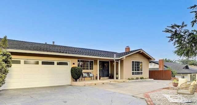 single story home featuring a garage