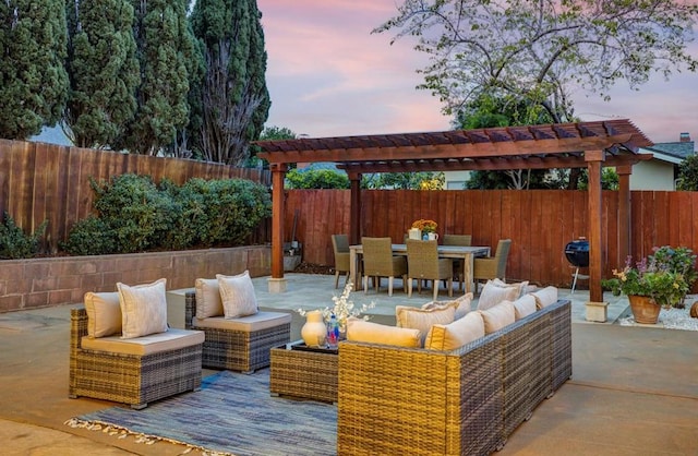 patio terrace at dusk with an outdoor hangout area and a pergola