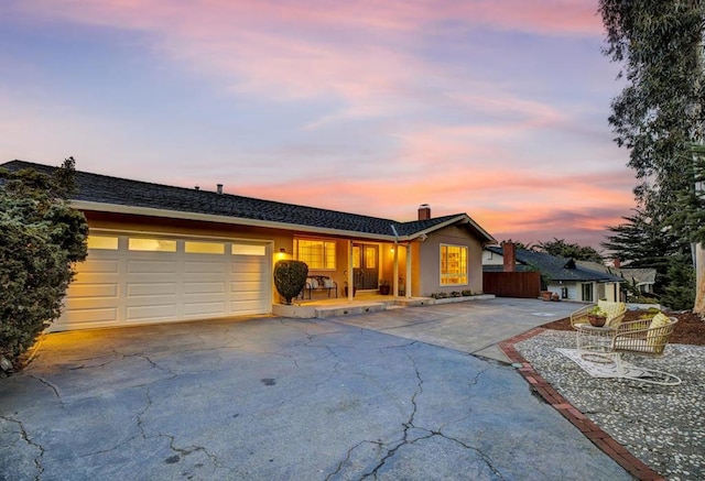 single story home featuring a garage