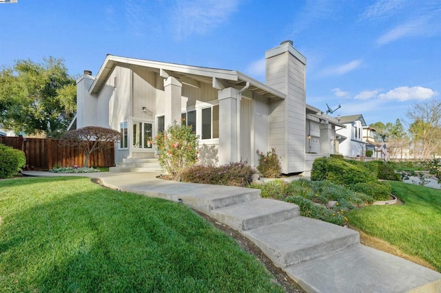 view of side of property featuring a yard