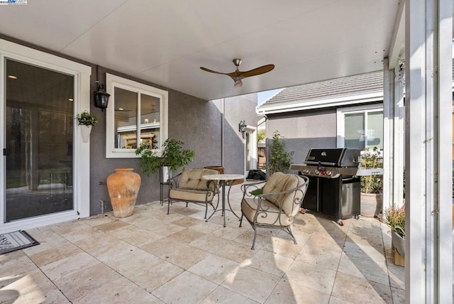 view of patio / terrace featuring ceiling fan and grilling area