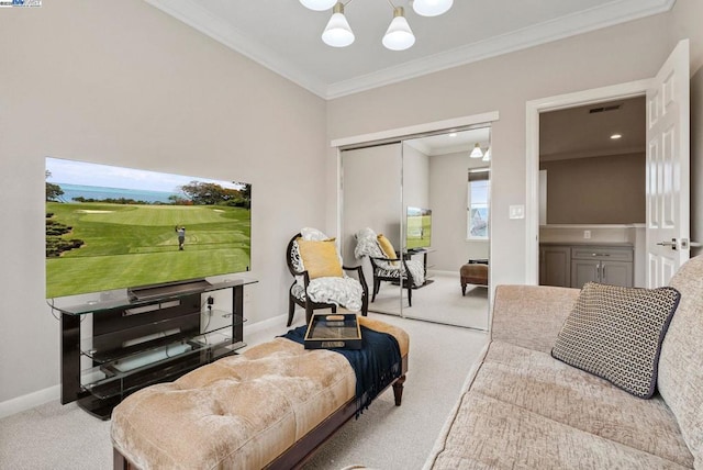 living room with ornamental molding, a chandelier, and carpet floors