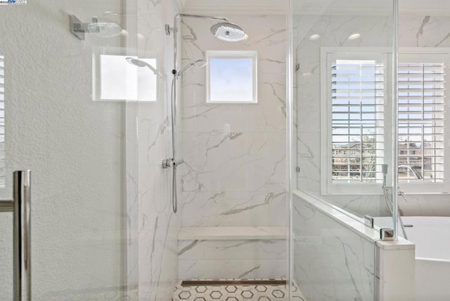 bathroom with separate shower and tub