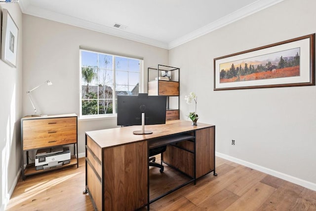 home office featuring ornamental molding and light hardwood / wood-style floors