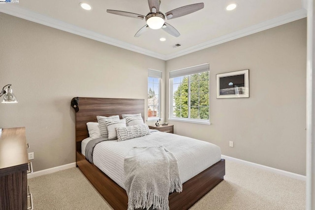 bedroom with ornamental molding, ceiling fan, and carpet flooring