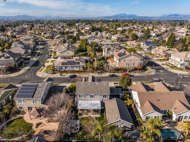 birds eye view of property featuring a mountain view