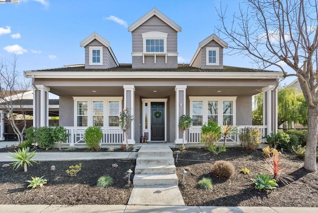 view of front of property featuring covered porch