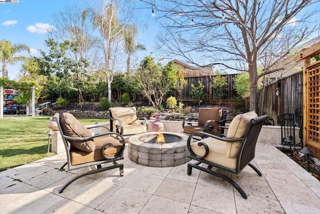 view of patio with an outdoor fire pit