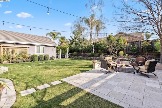 view of yard featuring a patio and a fire pit