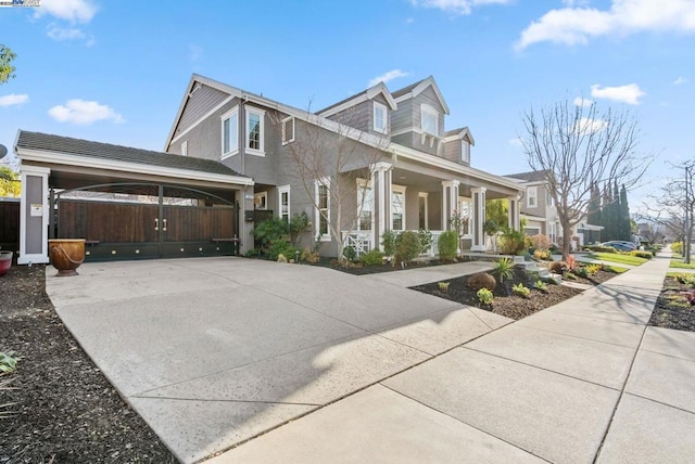 view of front of property featuring a carport and covered porch