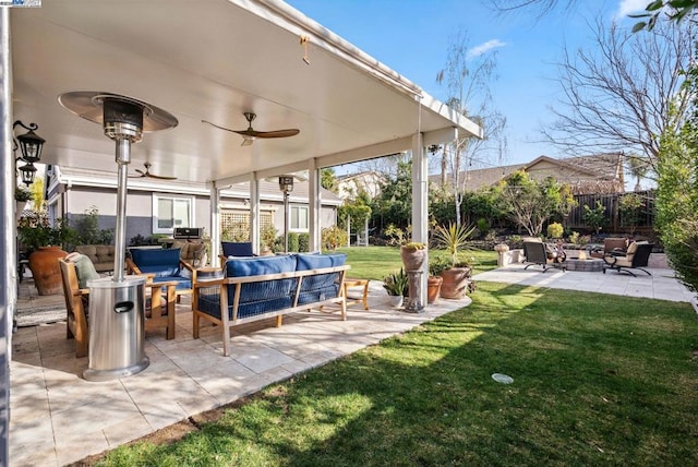 view of patio with outdoor lounge area and ceiling fan