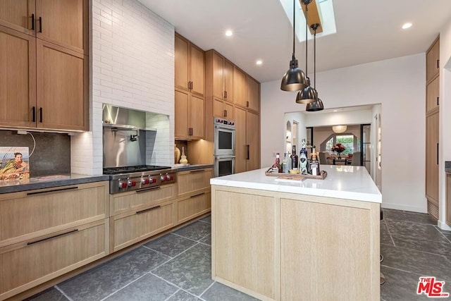 kitchen featuring a kitchen island with sink, decorative light fixtures, decorative backsplash, and appliances with stainless steel finishes