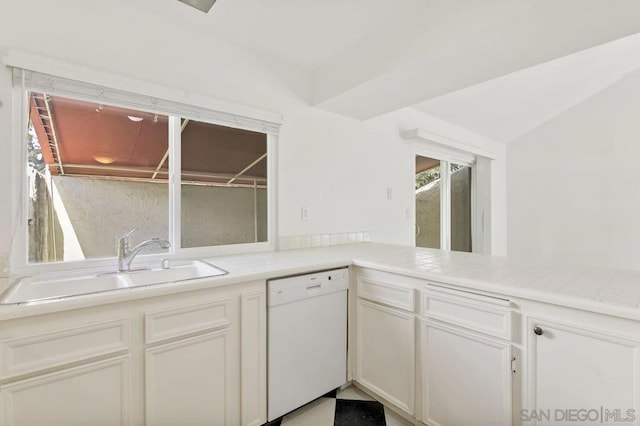 kitchen with white dishwasher, sink, white cabinetry, and kitchen peninsula