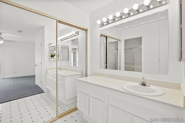 bathroom featuring vanity and ceiling fan