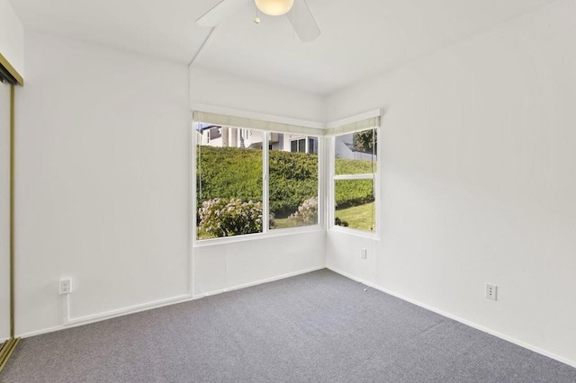 empty room with carpet and ceiling fan