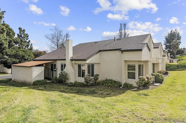 back of house with a yard