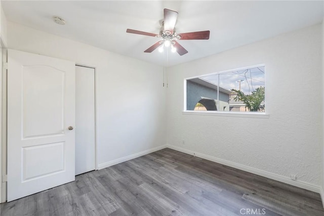 unfurnished room with hardwood / wood-style flooring and ceiling fan