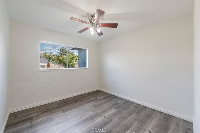 unfurnished room featuring ceiling fan and hardwood / wood-style floors