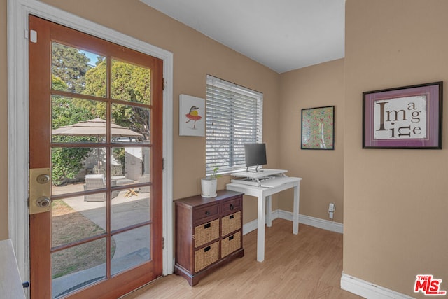 office space with light hardwood / wood-style floors