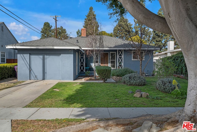 ranch-style home with a garage and a front yard