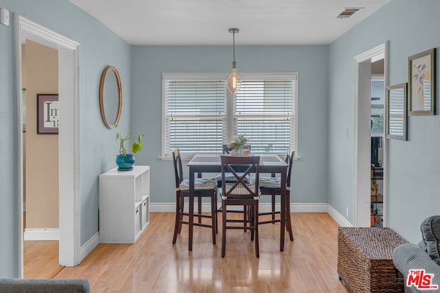 dining area with light hardwood / wood-style floors