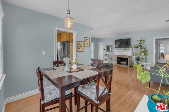 dining area featuring light wood-type flooring