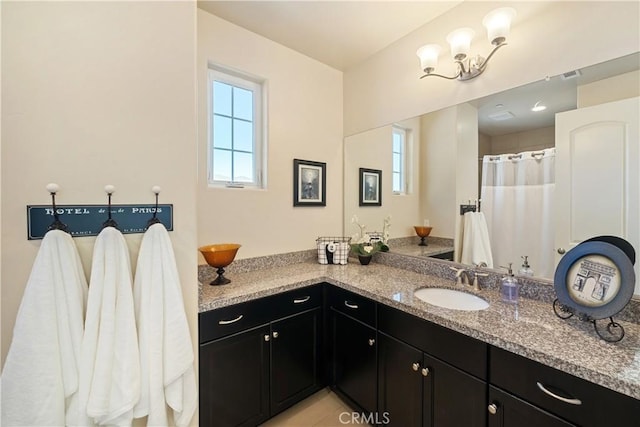 bathroom featuring vanity and walk in shower